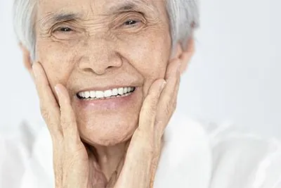 woman with dental implants smiling