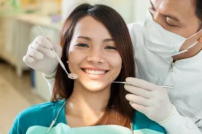 patient smiling during her first visit at Comfort Dental Meadowbrook