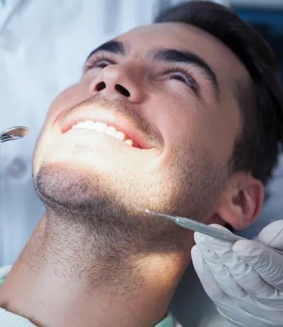 patient smiling during his dental appointment at Comfort Dental Meadowbrook