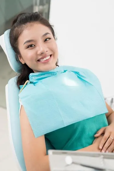 patient smiling in the dental chair at Comfort Dental Meadowbrook in Garland, TX